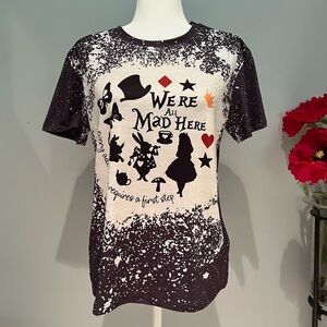 NEW Alice in Wonderland We’re All Mad Here Paint Splatter Women’s T-Shirt Sz M
